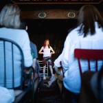 Rocketkar Studios Photo
Amanda Knox performs Cartwheel before a seated audience.