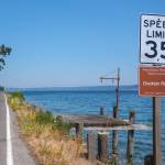 A new King County historic and scenic corridor sign sits beneath a speed limit marker along Dockton Road. Five signs are planned along the 4.7-mile heritage corridor. (Terry Donnelly Photo)