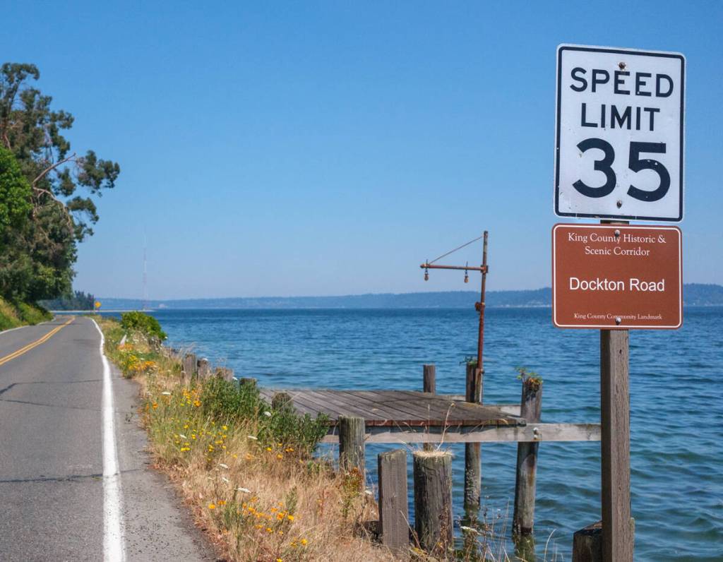 A new King County historic and scenic corridor sign sits beneath a speed limit marker along Dockton Road. Five signs are planned along the 4.7-mile heritage corridor. (Terry Donnelly Photo)