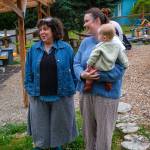 Parent educator Tami Brockway Joyce, left, stands on the co-op playground with class parent coordinator Fiona Lazare and her baby, Francis. (Kent Phelan Photo)