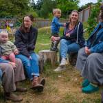 Toddler class parents talk summer survival tips on the co-op playground. From left: Maggie Hillding; Fiona Lazare, holding baby Francis; Marta Searles; Lyle with his mother, Ashley Christopherson; and parent educator Tami Brockway Joyce. (Kent Phelan Photo)