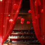 Red curtains frame the lantern-lit bar at Oh Vashon. (Mariel Torres Photo)