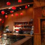 Red lanterns illuminate the Asian saloon-inspired interior of Oh Vashon. (Mariel Torres Photo)