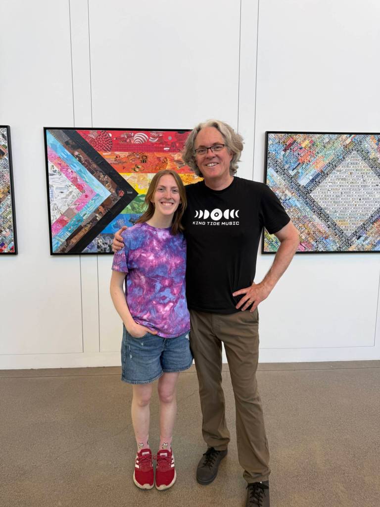 Lynann Politte Photos
Collaborators John Schuh and his daughter, Hannah Schuh, stand before the piece Pride Flag.